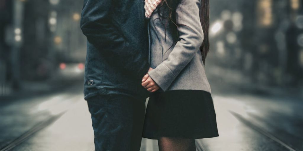 couple looking at each other lovingly in a cozy cafe