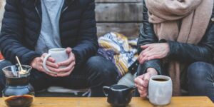 couple looking at each other lovingly in a cozy cafe